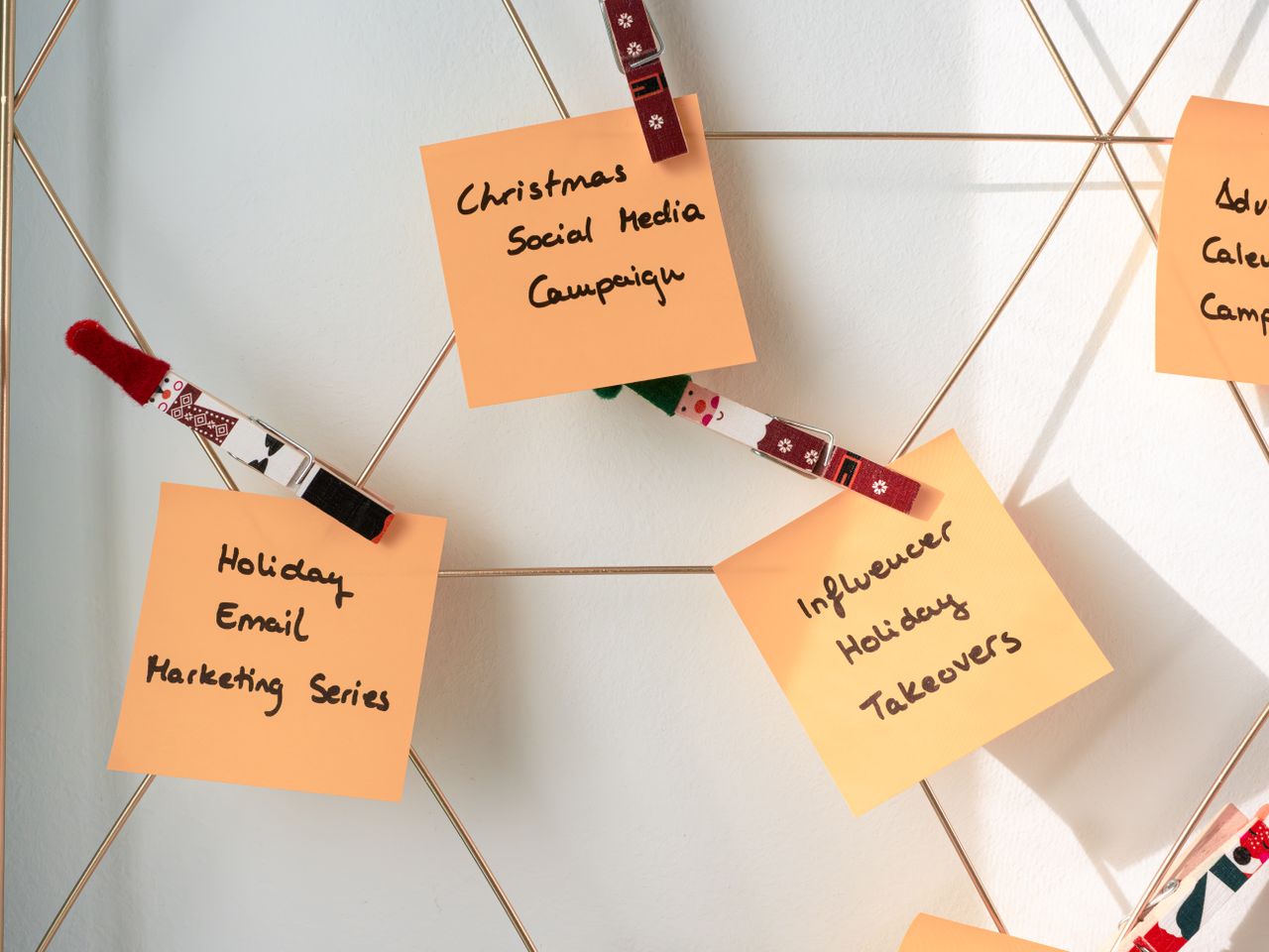 Adhesive notes featuring Christmas marketing ideas for social media and email campaigns.